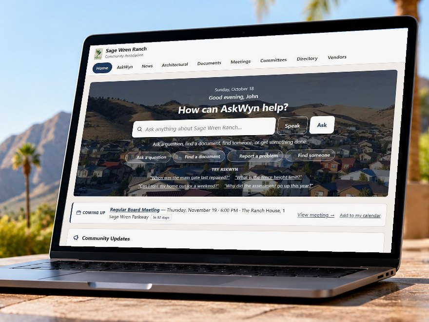 The AskWyn home page for a sample association, open on a laptop on a desert patio: an ask box, shortcuts to find a document or report a problem, and the next board meeting